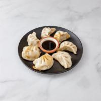 8. Pork Dumplings · 8 pieces. Served with a choice of style.