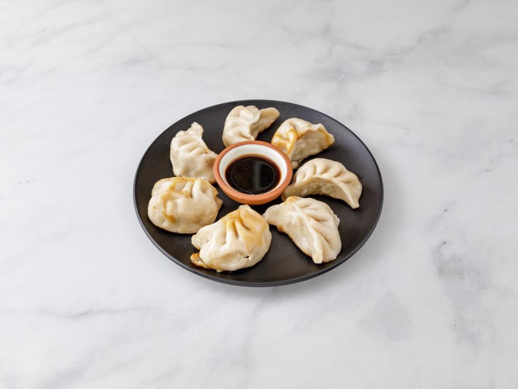 8. Pork Dumplings · 8 pieces. Served with a choice of style.