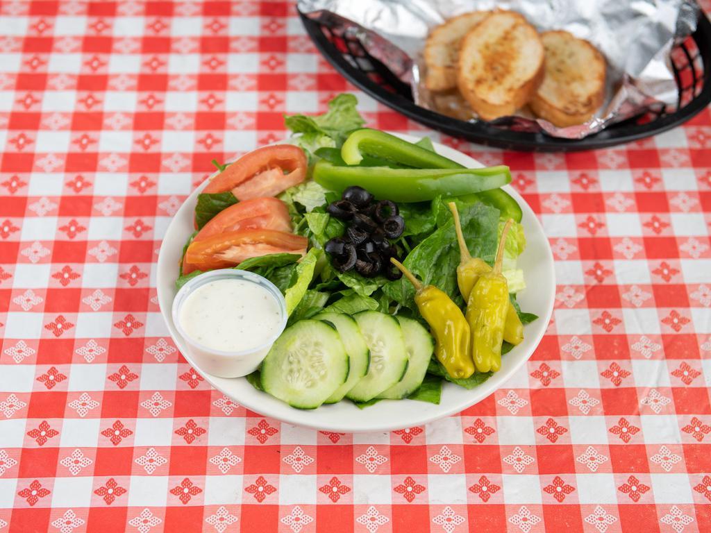 Garden Salad · Lettuce, tomato, cucumber, carrots, black olives and green peppers. Served with pita bread and dressing on the side. 