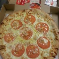 Shrimp Scampi Pizza · Shrimp, tomatoes, mozzarella cheese, garlic and oil sauce. Pizza is hand tossed and cooked i...