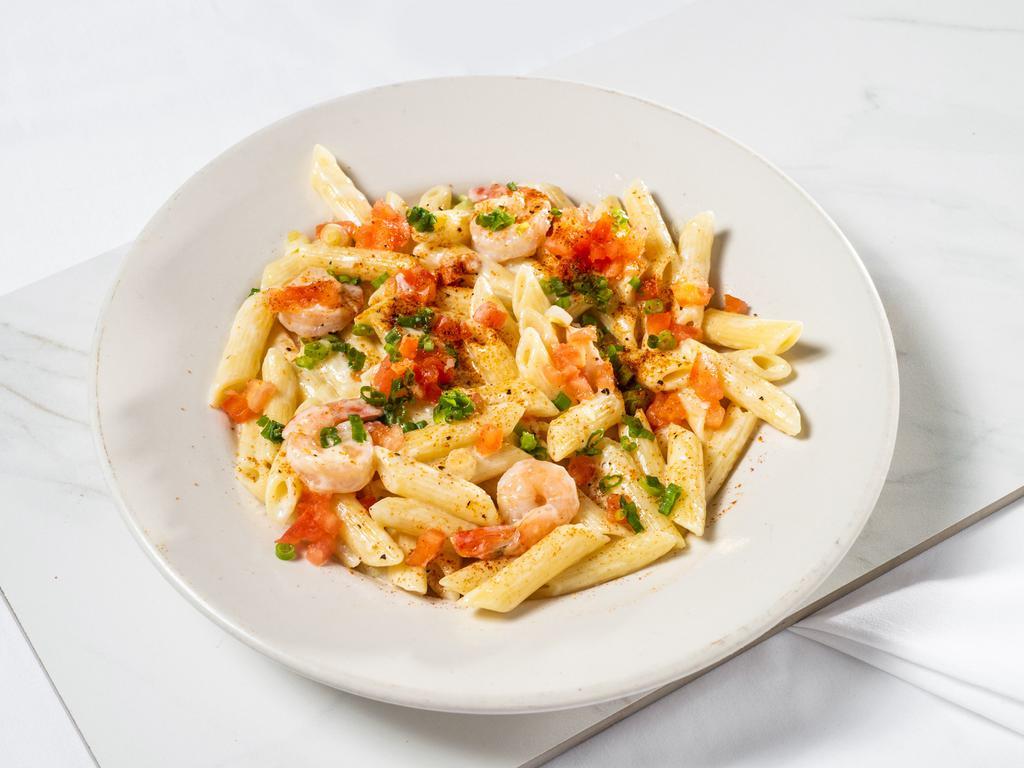 Cajun Shrimp · Grilled shrimp served over penne noodles with Cajun seasoning and special Alfredo sauce.