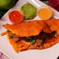 Ketotaco · Cheese taco shell, birria, cilantro, white onion, guacamole and salsa. 