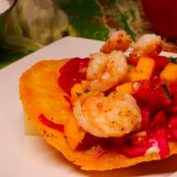 Shrimp Taco · Grilled shrimp marinated in garlic, lime, red cabbage, spices and mango salsa. 