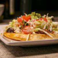 Sope · Thick tortilla served with birria, refried black beans, queso fresco, cabbage, pico de gallo...