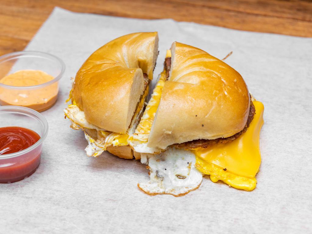 Sausage, Egg and Cheese  · 2 eggs with round sausage Pattie and cheese 
on roll, slice bread or bagel.
