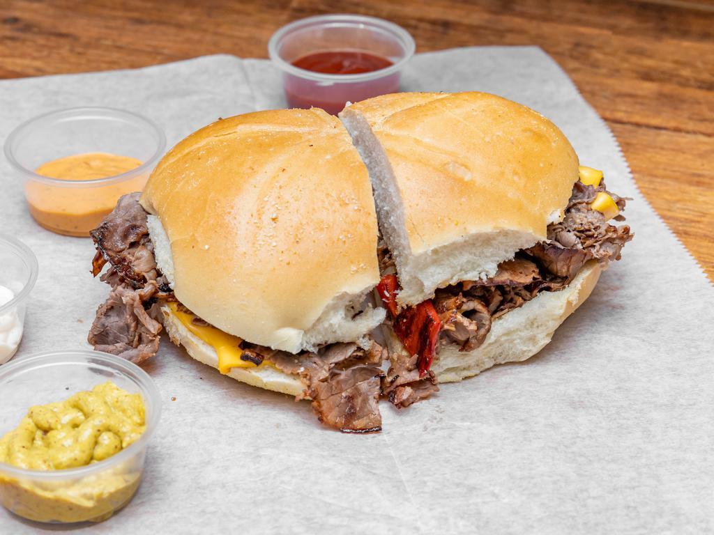 Philly Cheesesteak · Beef, peppers, onions, and cheese.