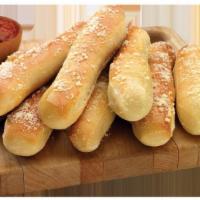 Garlic Bread · Eight pieces of bread sticks with flavors of butter and garlic, sprinkled with Parmesan chee...