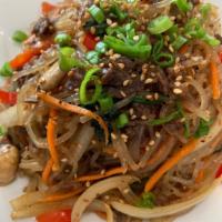 Japchae · Glass noodles sauteed with marinated ribeye and vegetables.