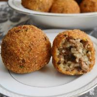 Arancini With Meat · 2 pieces. Arancini are italian rice balls that are stuffed with our beef bolognese, coated w...