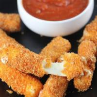 Mozzarella Sticks · 5 pieces. Mozzarella sticks are elongated pieces of breaded mozzarella, served with our sign...