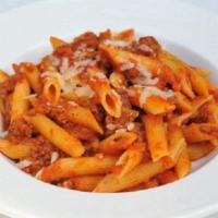 Pasta Alla Bolognese · Rigatoni pasta in our signature meat bolognese sauce topped with fresh basil and grated parm...