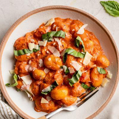Gnocchi  · Gnocchi pasta in our signature marinara sauce topped with fresh basil and grated parmesan cheese.