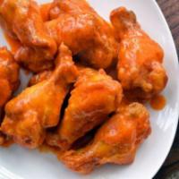 Buffalo Wings · 10 pieces. Our buffalo wings are a perfect mix of crispy, tender, and saucy, 10 to an order,...