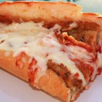 Eggplant Parmigiana Hero · Breaded thinly sliced eggplant, our signature marinara sauce topped with melted grilled hous...