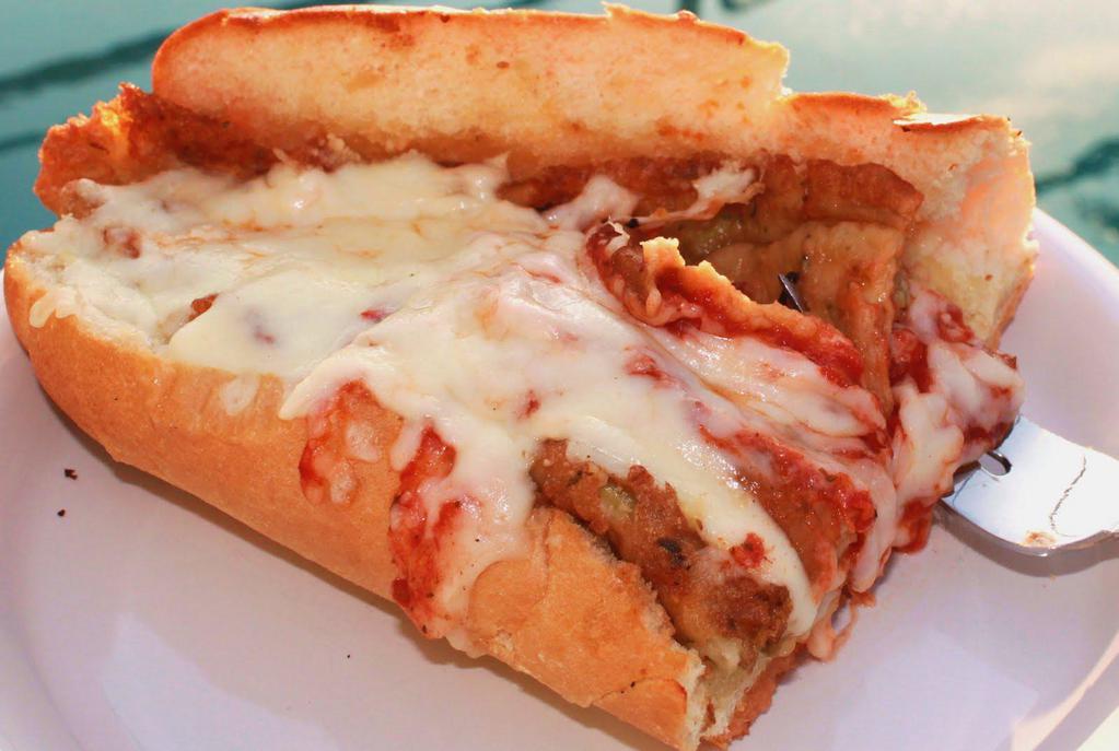 Eggplant Parmigiana Hero · Breaded thinly sliced eggplant, our signature marinara sauce topped with melted grilled house blend of three cheeses in our toasted italian sub roll.