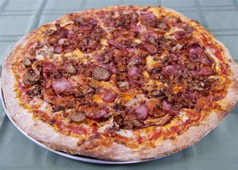 Carnivore Pizza · Tomato sauce, fresh mozzarella, roasted chicken italian sausage, pepperoni, salami, prosciutto. Comes sweet or spicy your choice.