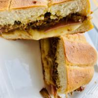 Cuban sandwich  · Roasted pork, smoked ham, Swiss cheese and marinated pickles mustard