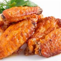 Chicken Buffalo Wings Dinner · 10 pieces. Cooked wing of a chicken coated in sauce or seasoning.