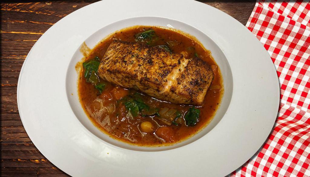 Grilled Salmon · Salmon fillet marinated in Turkish style, served with sauteed spinach. chickpeas, and tomato sauce.