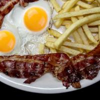 4. Huevos con Tocino · Eggs with Bacon. Served with fries and coffee with milk and bread with butter.