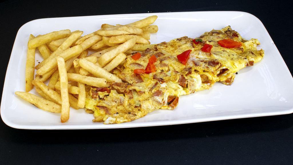 7- Tortilla de Chorizo · Spanish Sausage Omelette. Served With  & Bread With Butter