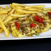 8. Tortilla de Platano Maduro Desayuno · Fried sweet plantain omelette. Served with coffee and milk with bread and butter.