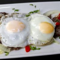 11. Bistec a Caballo Desayuno · Steak and eggs. Served with fries and coffee with milk and bread with butter.
