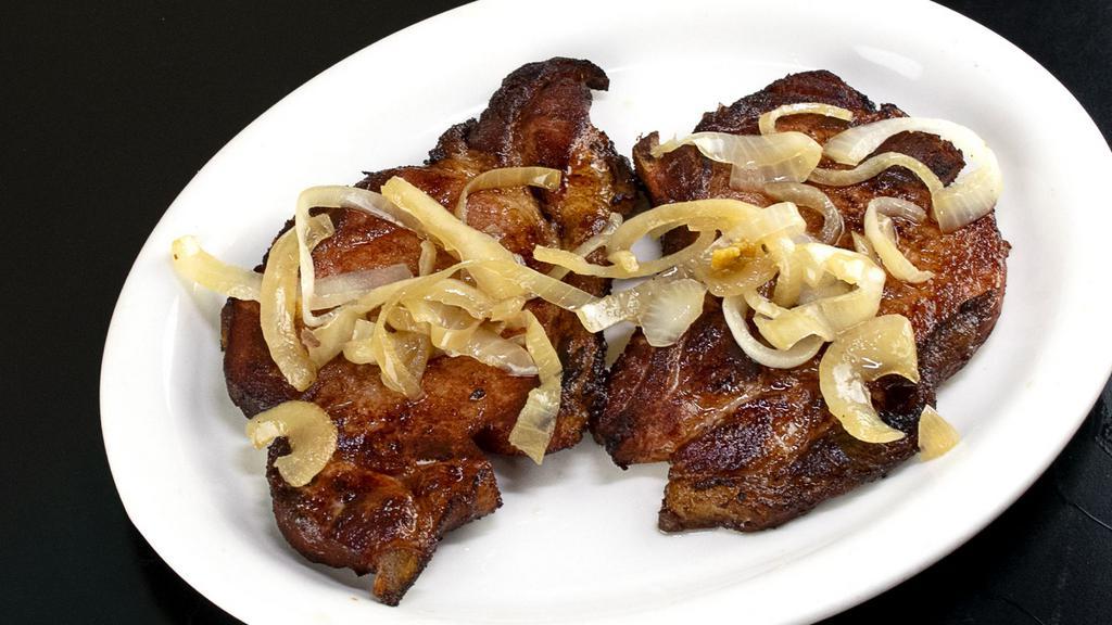 Chuletas de Cerdo Ahumadas · Smoked Pork Chops. Served With Your Choice of 2 Sides.
