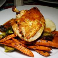 Brick Chicken · Brussel Sprouts, Roasted Baby Carrots, Mashed Potatoes and Chicken Jus.