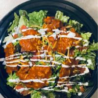 Buffalo Wing Salad · All white meat  Boneless Wings with Buffalo Sauce on a bed of lettuce tomatoes Blue Cheese C...