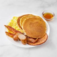 Pancakes Deluxe · Ham, bacon, sausage and 2 eggs on top. Served with butter and syrup.