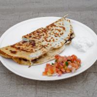Quesadilla · Flour tortilla with your choice of meat with mozzarella cheese served with guacamole and pic...