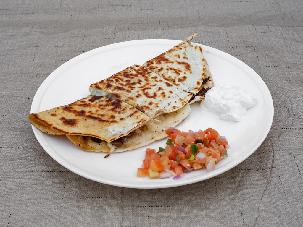 Quesadilla · Flour tortilla with your choice of meat with mozzarella cheese served with guacamole and pico de gallo.