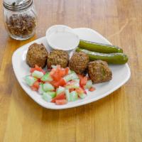 Falafel sandwich  · Falafel is a deep-fried ball or patty-shaped fritter made from ground chickpeas, fava beans ...