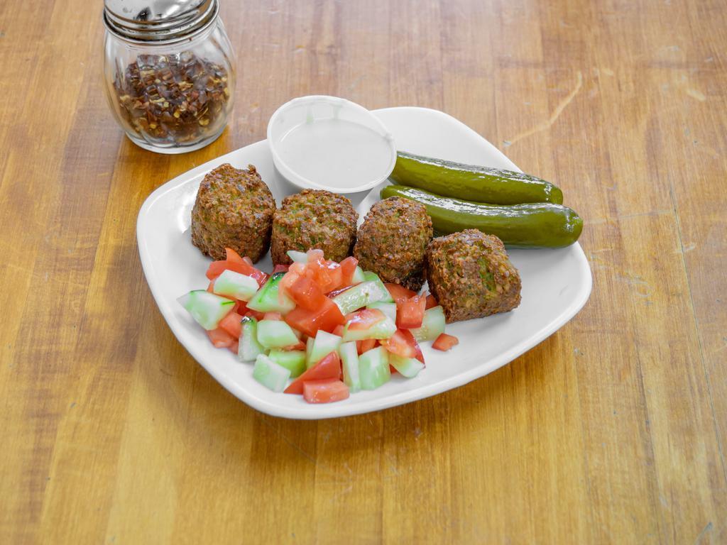 Falafel sandwich  · Falafel is a deep-fried ball or patty-shaped fritter made from ground chickpeas, fava beans parsley , and spices 