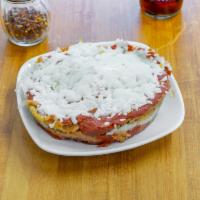 Eggplant Parm · Eggplant topped with cheese and tomato sauce.