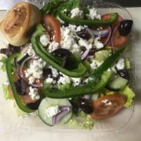 Greek Salad · Garden salad topped with feta cheese and black olives.