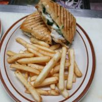 Chicken Pesto Panini · Roasted peppers and fresh mozzarella. Includes fries. Made on homemade focaccia bread.
