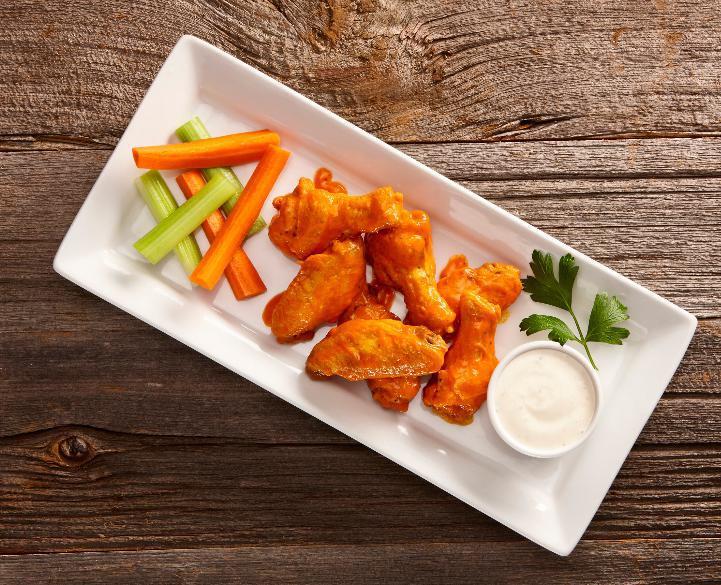 Chicken Wings · One pound of bone-in wings, tossed with Buffalo, BBQ, or Jamaican Jerk (dry rub) sauce, served with celery and carrot sticks, choice of ranch or blue cheese dressing.