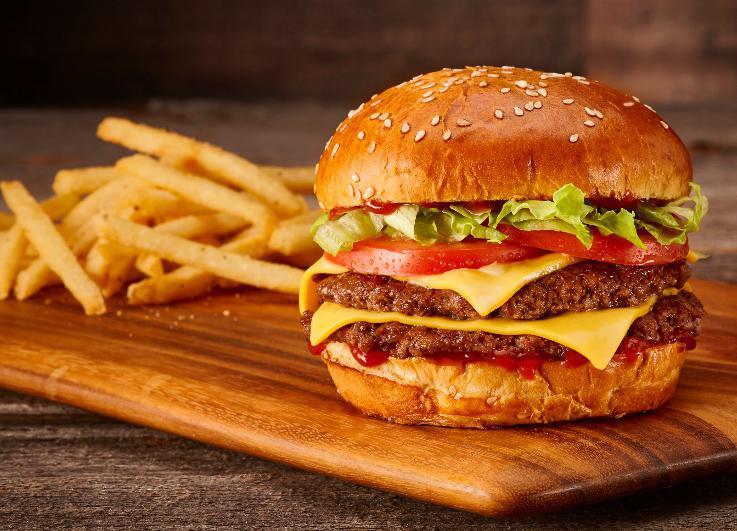 Classic Double · Double smash burger, American cheese, lettuce, tomato, and ketchup on a sesame bun.