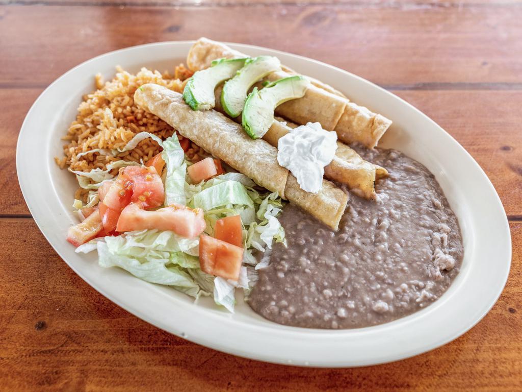 12. Crispy Tacos Plate · 3 crispy tacos, beef or chicken stuffed with lettuce, tomato, and cheese served with beans and rice. FREE SOPAILLA