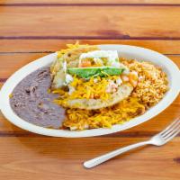 16. Combination Plate · 1 crispy beef taco, 1 cheese enchilada, 1 chicken puffy taco, beans, rice, salad, tomato, an...