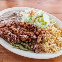 23. Pastor Plate · Tender chopped pork marinated spices, layed on top of Nopalitos and served with beans, rice,...