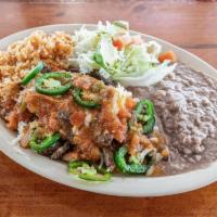 30. Puntas de Filete Al Albanil · Chopped steak sauteed with fresh jalapenos, tomato, onions, and melted white cheese served w...
