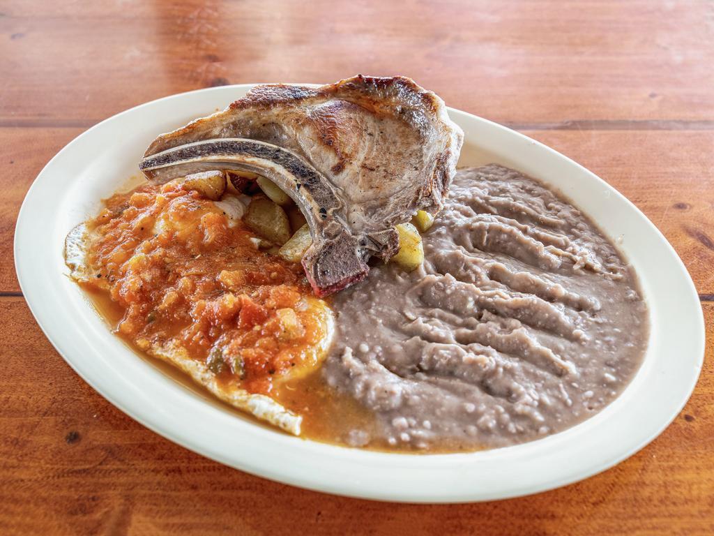 32. Pork Chops Plate · 2 pork chops with ranchero sauce served rice, beans, salad, avocado and 2 tortillas. FREE SOPAPILLA