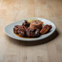 Oxtails · Flavorful Pieces of braised oxtails, falling off the bone.