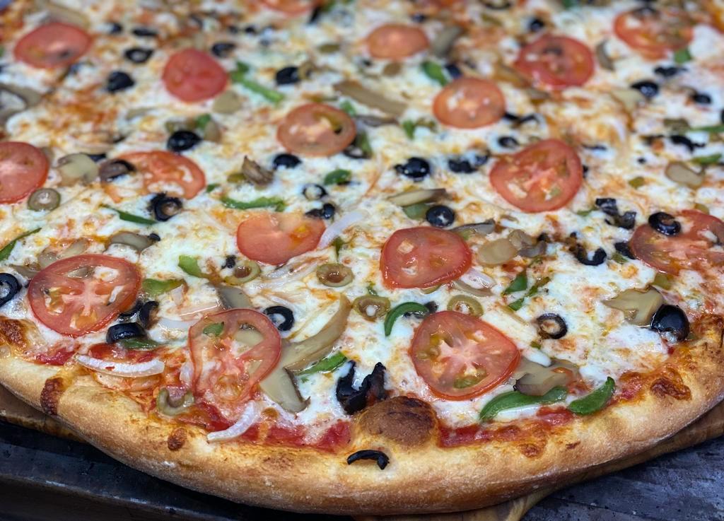 Veggie Supreme Pizza · Onion, tomato, green peppers, marinated mushrooms, black olives, green olives and mozzarella cheese.