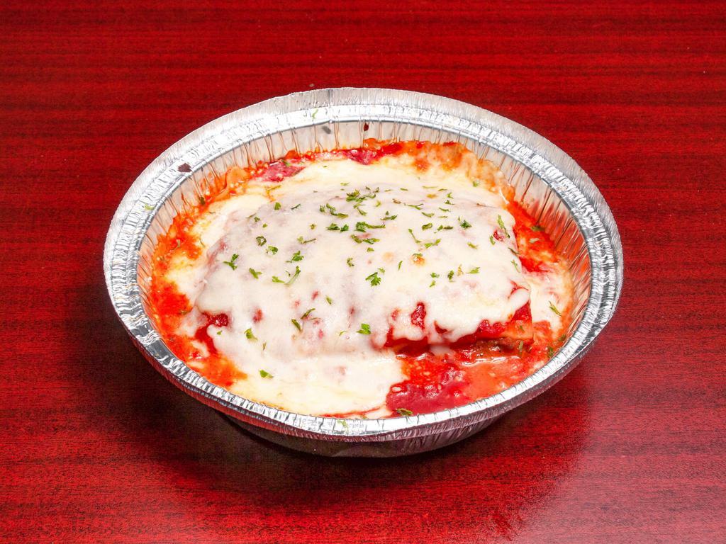 Lasagna · Ground beef, mozzarella and ricotta cheese with our special sauce on the side. Served with a side salad and garlic bread stick.