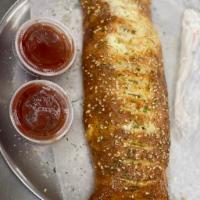 Stromboli · Pepperoni, onions, green peppers, ham, salami, mozzarella cheese with our special sauce on t...