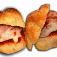 4 Meatball Sliders · Delicious homemade mini meatballs sandwiches. Made on our homemade garlic knots.